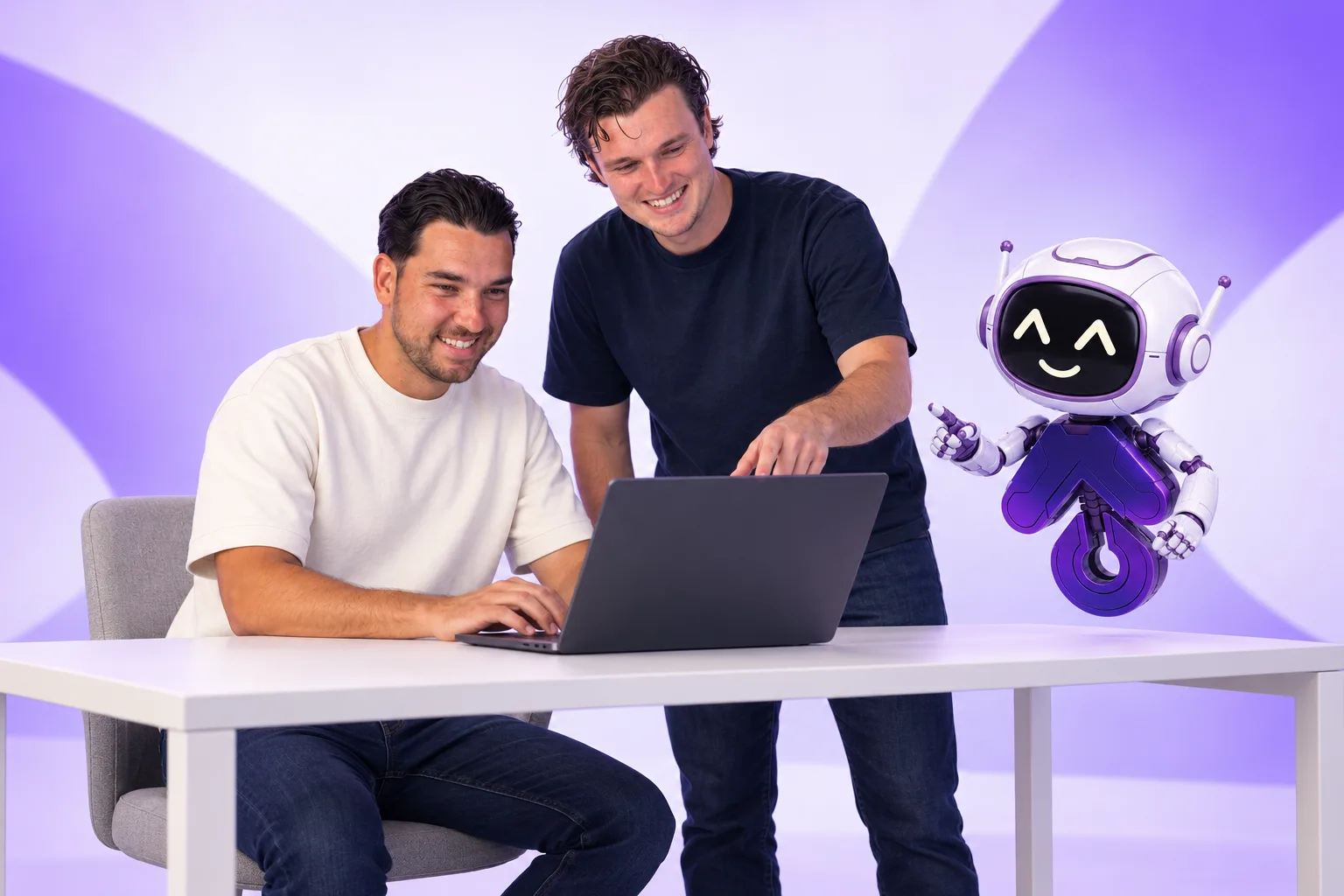 Koen and Roy behind a laptop, with Mate the SEO robot beside them